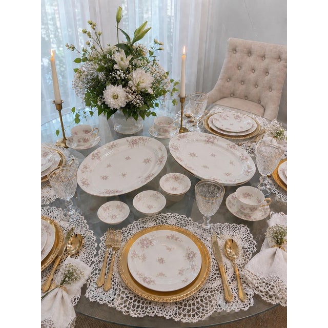 Elegant vintage Haviland Limoges porcelain dinnerware set featuring delicate pink rose garlands on fine white porcelain....