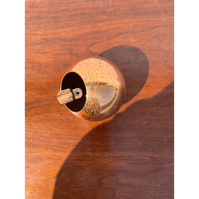 This funky orb would be perfect as a shelf object or for burning Palo santo. We love the shape and the warm copper color....