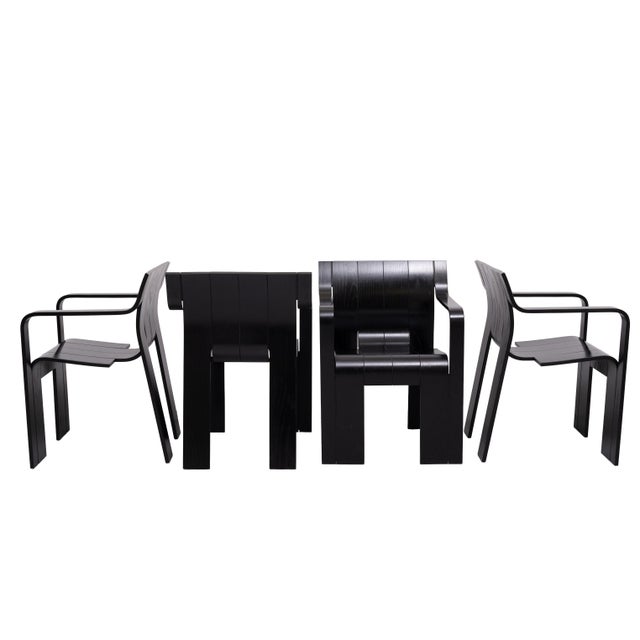 Stunning set of 4 Strip chairs with armrest. Black color. I bought these chairs from the first owner. He was very careful...