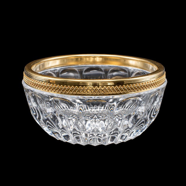 This is a vintage potpourri dish. An English, gilt metal and cut glass display bowl, dating to the late 20th century,...