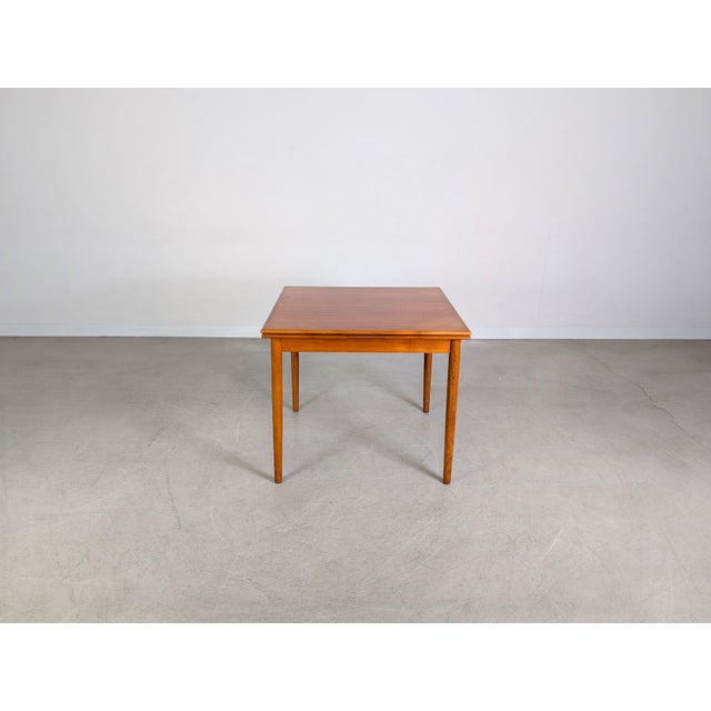 We are offering a beautiful extendable teak dining table from the 1960s-70s for sale. Its practical square shape makes it...