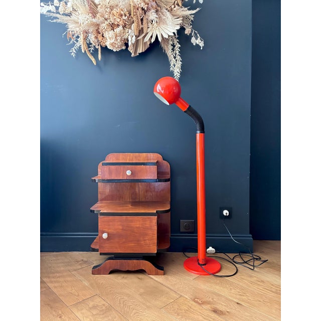Orange lacquered metal floor lamp with adjustable arm. 1970s. In very good condition. Electrical connection checked and...