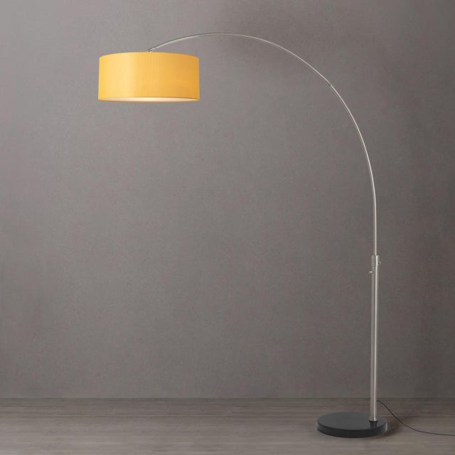 The Float Arc Lamp is a modern arc lamp designed by Peter Morelli in 1960, featuring a satin nickel steel body and a black...