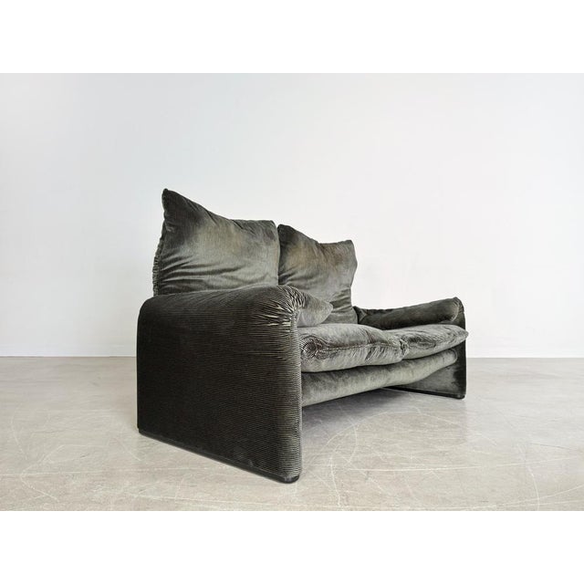 Beautiful dark green Maralunga two-seater sofa in velvet/corduroy from Cassina. The design comes from Vico Magistretti and...
