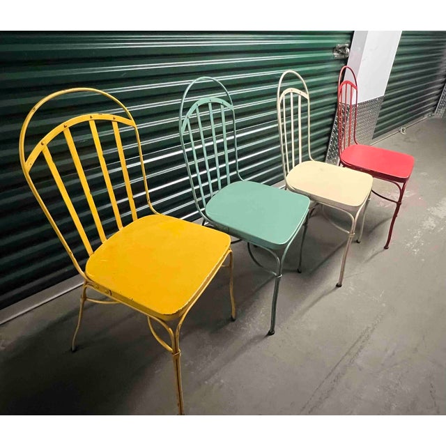 Set of 4 vintage outdoor Pottery Barn bistro chairs. Handcrafted of powder-coated welded steel and finished in four colors...