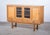 Oak sideboard attributed to Danish designer Henning Kjærnulf, crafted in Denmark during the 1960s. Executed in a...