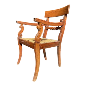 Antique Caned Anglo-Indian Mahogany Sabre Leg Armchair