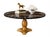 Description Striking Hollywood Regency–style pedestal table featuring a dramatic round black marble top with bold white...