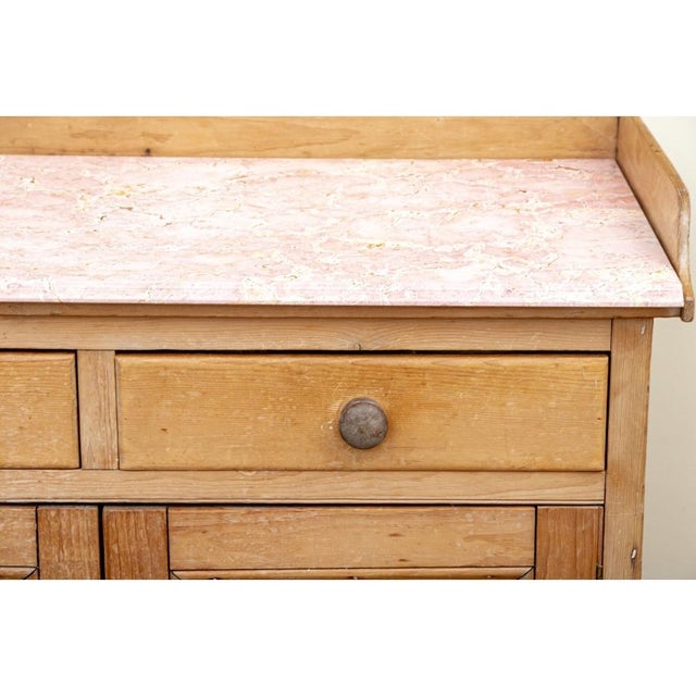 A classic Antique Dry Sink well crafted in light honeyed brown pine with dove-tail construction on the case as well as the...