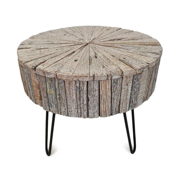 Salvaged round white wash wood side table crafted in a unique pinwheel design. Modern iron legs. Each is unique in exact...