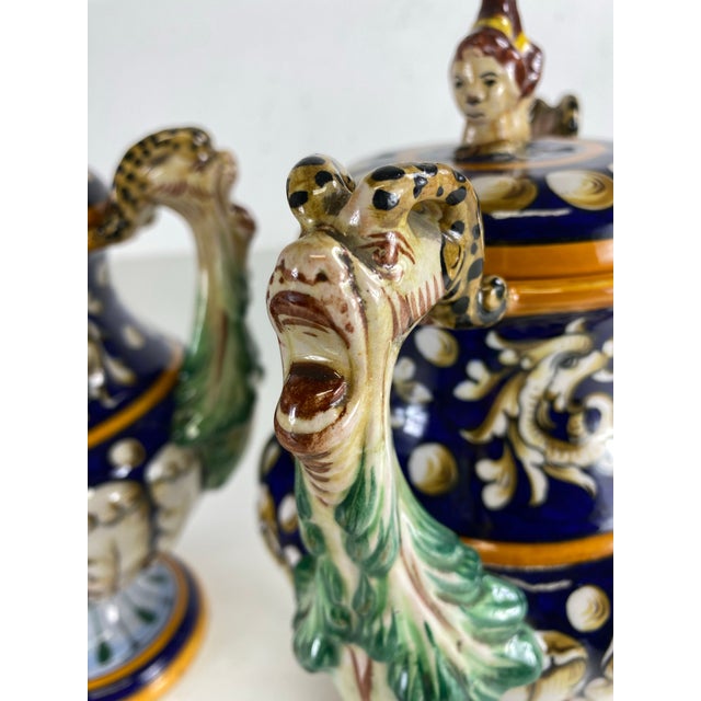 This is a beautiful pair of mid-century vintage Italian hand painted pottery urns with lids. This pair of urns have...