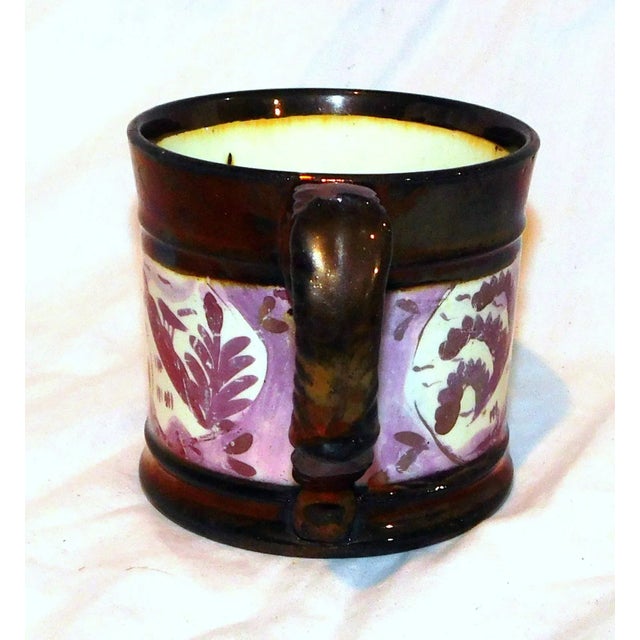 Lovely 19th century pink and copper lusterware mug with foliate scene