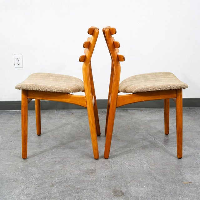 Unique lader back beech wood dining chairs designed by Poul Volther. Looks great from any angle. Refinished throughout....