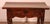 Superb 17th-century Spanish Renaissance walnut table, known as a "tosinera," with a central drawer. A small table of...