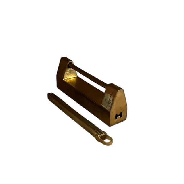 Introducing a Pair of Mid-Century Mastercraft Brass Furniture Locks, embodying the timeless elegance and functionality...
