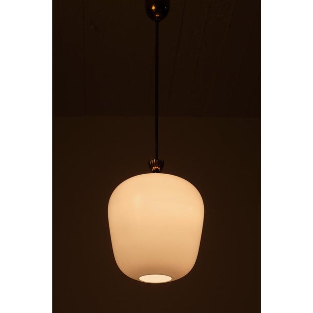 Swedish glass and brass pendant by Böhlmarks, 1940s. Very good condition, new wiring. This piece is attributed to the...