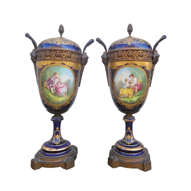 Pair of covered vases in the Sèvres style, with a bronze mount: the vases are decorated with gallant scenes on the front,...
