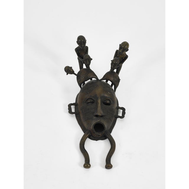 Acquired from Albert F. Gordon's Tribal Arts Gallery in NYC in the early 1970s, this is a cast iron Senufo Kpelie mask...