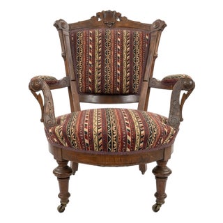 Carved Wood Armchair With Casters For Sale