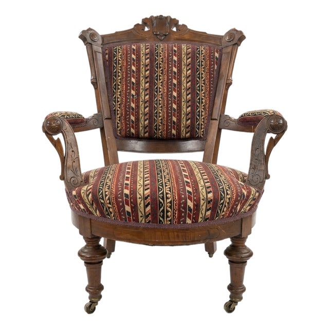 Carved Wood Armchair With Casters For Sale