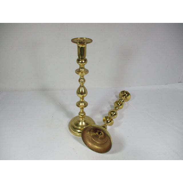 This classic pair of candleholders are made of solid polished brass. They are 14 1\2" high and are designed with various...