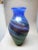 Impressive vase by Ada Loumani in handmade glass and decorated in a spiral pattern. Beautiful iridescent colors. Signed in...