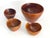 Offered is a set of 4 hand-carved teak wood cone shaped bowls. The large bowl has a straight angled rim and the 3...