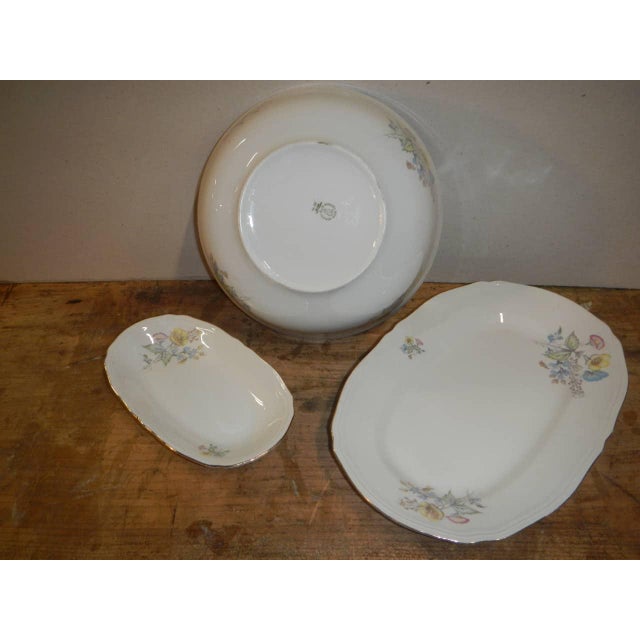 composed of 2 oval plates of 32x21 cm and 21x12 cm and a cup diameter 25 cm h 9 The flowers are a little faded in some...