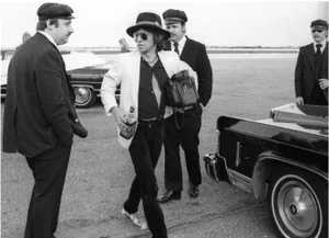 "Keith Richards, Holding a Bottle of Jack Daniels, Midwest Airport, 1979" Henry Diltz Silver Gelatin Black and White Photograph #103