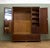 A quality Georgian Revival mahogany triple wardrobe by the renowned British makers Maple & Co., dating from the early 20th...