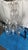 This listing features a large crystal chandelier with intricate details such as beading and hand-carved crystal pendants....