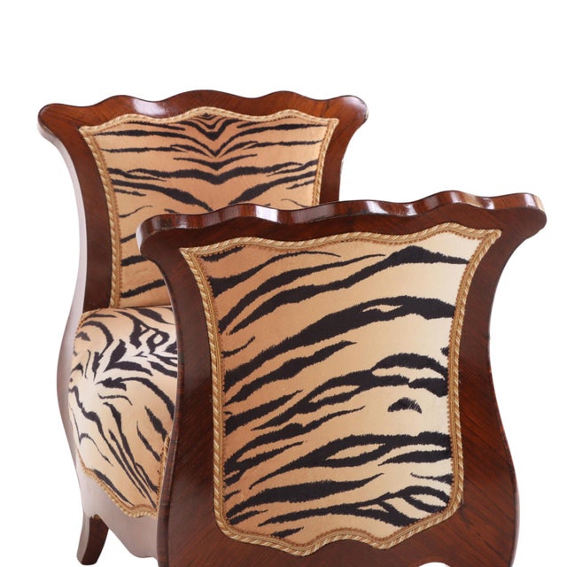 Each bench features a richly figured kingwood frame with a hand-carved apron, graceful cabriole legs, and finely molded...