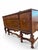 Add grand architectural presence to your dining room with this magnificent 1920s Jacobean Revival sideboard. Crafted from...