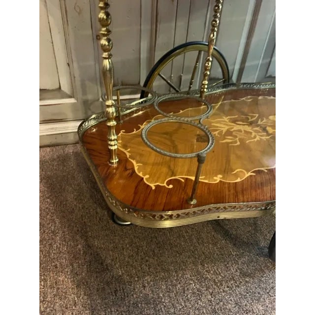 This stunning Italian Service Bar Cart Trolley is a true masterpiece of craftsmanship. The intricate floral marquetry and...