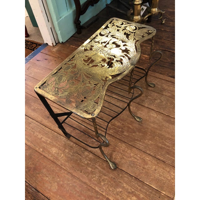 Beautiful 19th century elaborately cut and engraved brass trivet having a horse and rider centrally depicted on top, a...