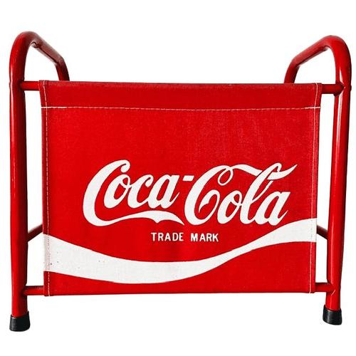 This magazine rack is finished in the iconic Coca-Cola red and features a sturdy metal frame with a canvas storage...
