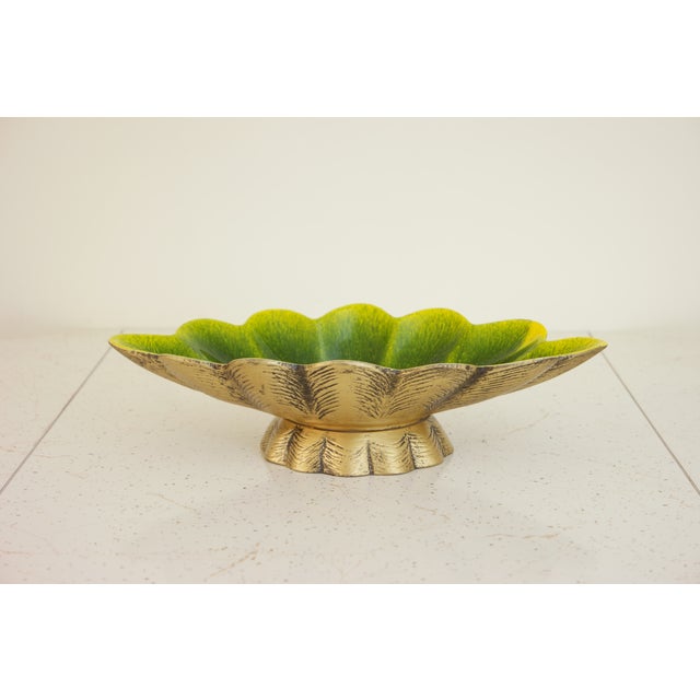 This vintage mid-century modern dish is made of ceramic, which is glazed in yellow & green on the inside, and painted gold...
