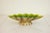 This vintage mid-century modern dish is made of ceramic, which is glazed in yellow & green on the inside, and painted gold...