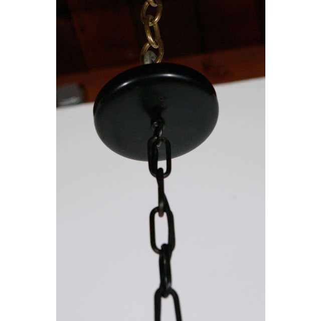 French chandelier with iron and brass details; newly rewired with six candelabra sockets covered by newly custom made...