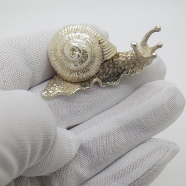 A striking and unusual piece, this vintage Italian figurine represents a life size snail, rendered in solid silver with a...
