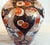 A magnificent pair of Japanese Imari porcelain lidded vases dating to the late 19th century Circa 1860 Each vase is richly...