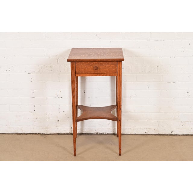 A gorgeous antique Mission or Arts & Crafts quarter sawn oak nightstand or occasional side table In the manner of Charles...