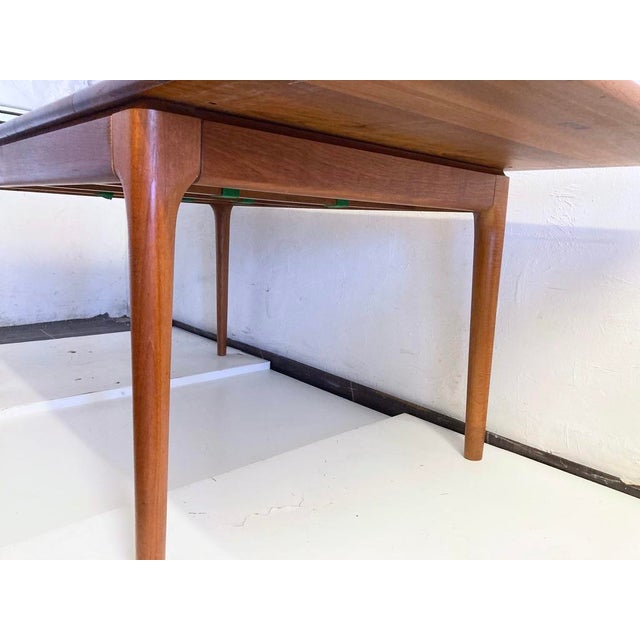 1 large dining room table from the 60s and 70s with 2 insert discs, made in Denmark by Glostrup. Solid teak. Very good...