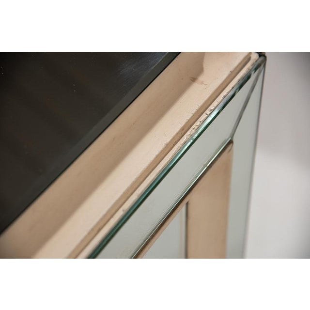 A rare and stunning Art Deco sideboard from 1940s France, entirely clad in mirrors. This elegant piece features three...