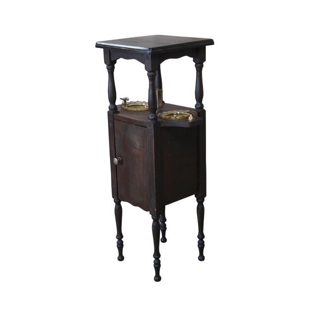 A quaint smoke stand by H.T. Cushman, circa early 20th century. Features wooden construction with turned pots, 2 central...