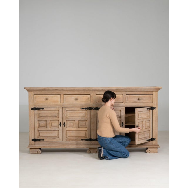 A sideboard whose natural bleached oak, multi-drawer, open shelving gives it real character at first glance. It was made...