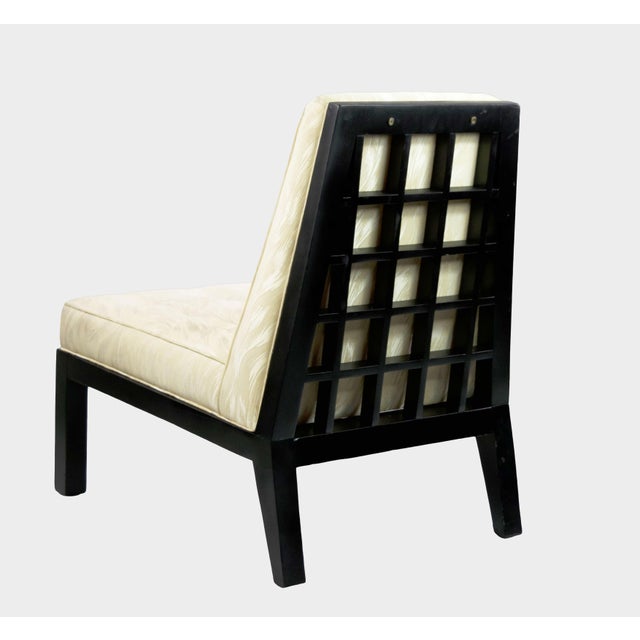 Pair of Ebonized Mahogany screen back chairs in the manner of James Mont and Edward Wormley. These stunning chairs are...