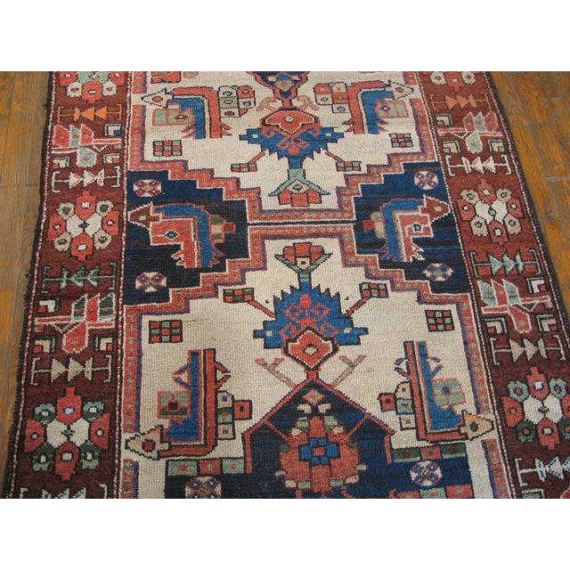 Handwoven antique NW Persian carpet. Woven, circa 1920. Runner size: 3'5" x 12'7". Ivory background with stacked geometric...