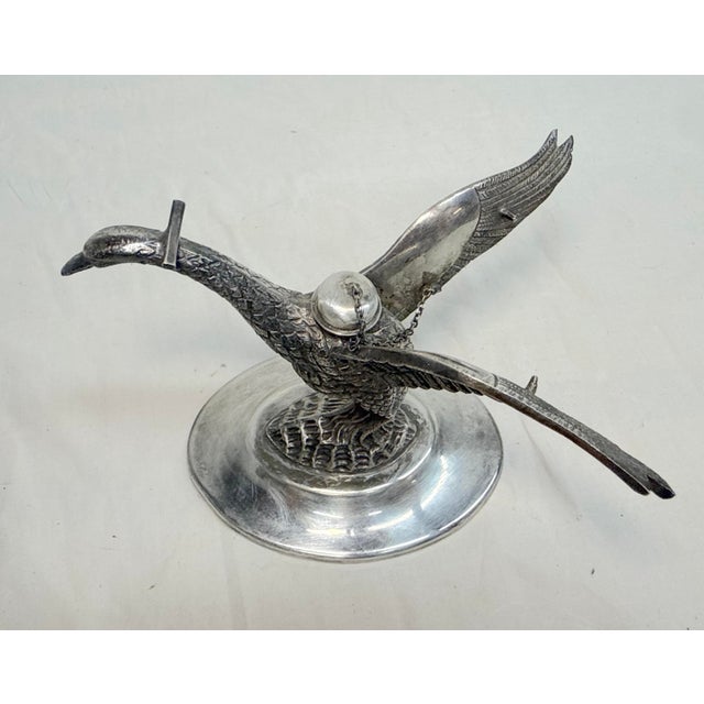 Up for sale is an exquisite antique silverplated swan shaped brandy warmer table top oil lamp from the early 1900s. This...