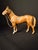 Early 20th-century American cast iron standing horse figure, likely manufactured by the Hubley Manufacturing Company of...